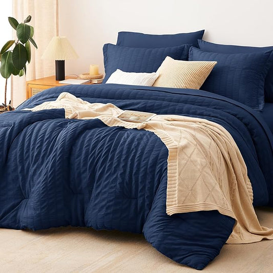 CozyLux Oversized King Comforter Set Navy Blue Seersucker 7 Pieces 120x98 Bed in a Bag Comforter Set with Sheets, Luxury Soft Bedding Sets with Down Alternative Comforter, Sheets, Pillowcases & Shams